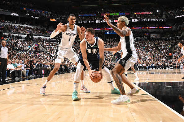 Dallas Mavericks superstar Luka Doncic gets trapped by San Antonio Spurs' Victor Wembanyama and Jeremy Sochan.